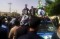 Arrests follow funeral of self-immolating street vendor