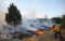 Stubborn forest fires burn in two provinces