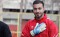 Football player banned from games over photos