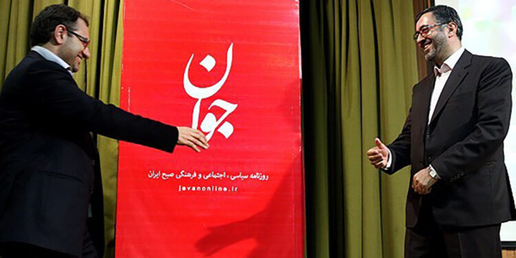 Abdollah Ganji (right) and Seyyed Nezamoldin Mousavi (left) beside Javan Daily's banner - Photo: Fars